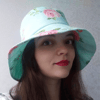 Summer hat bucket made of cotton in flowers. Beach sun hat for women. Fashion designer hat in roses. Cute elegant hat.