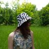 Cotton bucket hat with zebra print. A fashionable, stylish designer hat with an animal print. Summer cute sun hat.