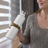 cropped-face-mockup-of-a-middle-aged-woman-holding-an-aluminum-bottle-33490_compressed.jpg