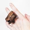 large wooden ring with a live edge on the hand 2