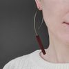 long red wood earring on the ear 2