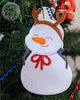 snowman with antlers on christmas tree