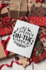 christmas-card-mockup-lying-over-gifts-and-ornaments-23838.png