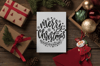 christmas-holiday-greeting-card-mockup-with-gift-boxes-and-santa-ornament-23824.png