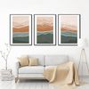 three paintings depicting mountains abstraction in green-orange tones