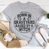 born-in-a-graveyard-raised-by-a-witch-tee-peachy-sunday-t-shirt
