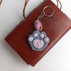 Crochet_Cat_Paw_on_a_Brown_Notebook_with_a_Pink_Keychain_8.jpg