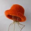 Orange-pumpkin bucket hat made of faux fur. Cute fuzzy bucket hats.