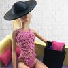 Barbie's poolside attire featuring a fashionable swimsuit