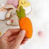 Felt Easter carrot cookie in the authors hand