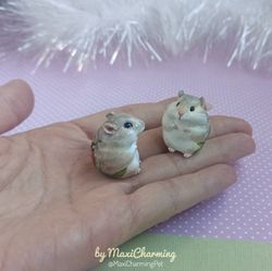 tan hamster figurine with a ladybug pattern on the back