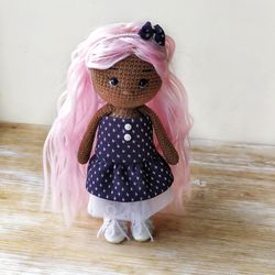 Dark skin African American doll with bright pink hair