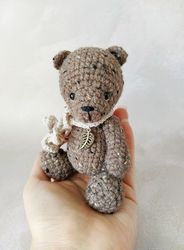 Crocheted teddy bear with pendant