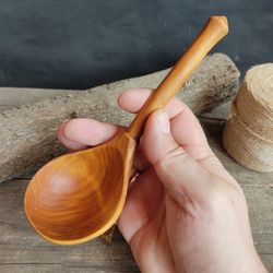 Handmade wooden spoon from natural birch wood for serving