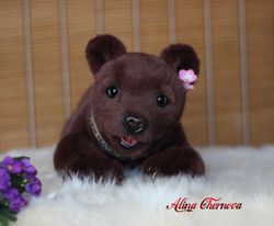 Teddy bear. Nice gift. Toy bear. A gift for a loved one. Love to the animals. Plush bear toy. Realistic toy.