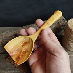 Big handmade wooden scoop for bulk products from natural juniper wood