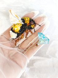 Brooch yellow bumblebee with glass flower, foldable wing