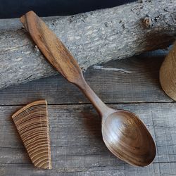 Handmade wooden spoon from natural walnut wood for eating or serving