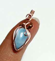 A tiny copper necklace with a rare precious larimar.