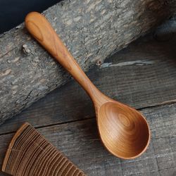 Handmade wooden scoop from apricot wood for ground coffee or coffee beans