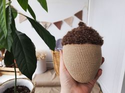 Stuffed biege acorn toy for Home decor. Acorn in Scandinavian style. Decoration of apartments and houses. Universal gift