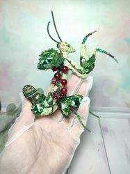 Embroidered brooch green praying mantis with red currant leaves and berries.