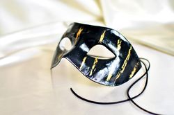 Black and gold men masquerade mask to halloween costume. Venetian mask Colombina. Cosplay masks to masquerade costume.