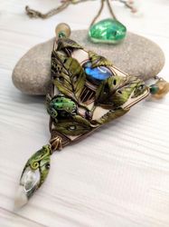 Green frog pendant with elaborete composition