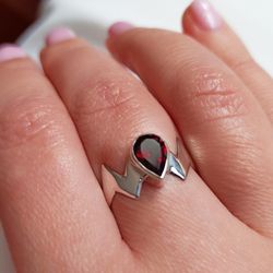 Silver ring with garnet.