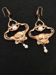 Custom Art Nouveau Symbolist earrings crowned with two snakes