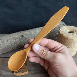 Handmade wooden spoon from beech wood for eating or serving