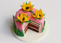 Miniature pink cake with yellow flowers, dollhouse food for dolls at 1:12 scale