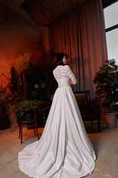 High neck lace tulle wedding dress. Closed modest bridal gown with hight belt