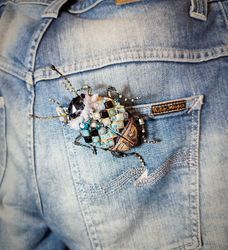 Embroidered brooch with a beetle in a sweater and jeans, a joke brooch