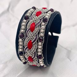 Wide womens Sami bracelet. Scandinavian design jewelry. Black genuine leather bracelet with garnet