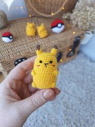 Keychain for Pikachu keys. Small toy from the popular cartoon "Pokemon" yellow pikachu. Crochet keychain yellow Pokemon