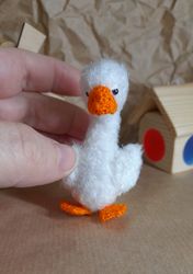 Miniature crochet goose. Fluffy white goose. Crochet bird. White poultry.