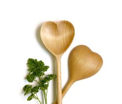 Set of two salad spoons in the shape of a heart. birch wood
