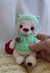 Amigurumi handmade animal bear in sweater and hat. Crochet plush bear. Collectible teddy bear. Cute crochet fluffy baby.