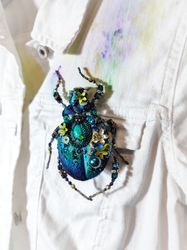 Blue embroidered beetle with pearls, the head is embroidered separately