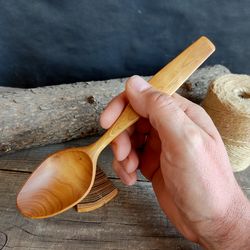 Handmade wooden spoon from natural aspen wood for eating