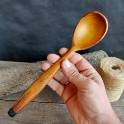 Handmade wooden spoon from natural mulberry wood for serving or cooking