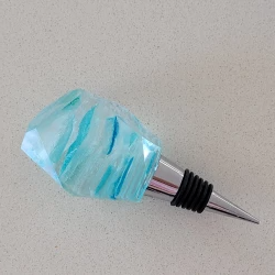 Resin wine bottle stopper with embedded blue and aqua sea glass