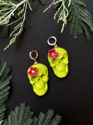 Green skull earrings with a flower on halloween