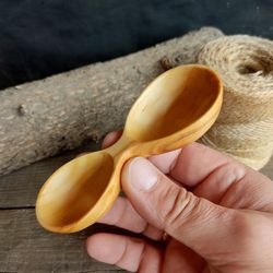 Handmade wooden measuring scoop from natural willow wood for coffee or bulk products