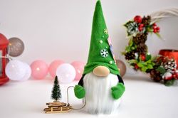 Scandinavian Christmas gnome with a Christmas tree