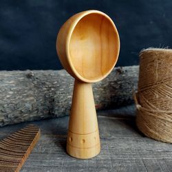 Handmade wooden scoop from natural willow wood with decorated handle for coffee or bulk products