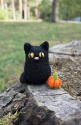Needle felted black cat with a tiny pumpkin Halloween decor