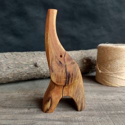 Handmade wooden figurine of elephant from birch wood