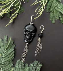 Asymmetrical Hanging Black Skull Earrings with a chain